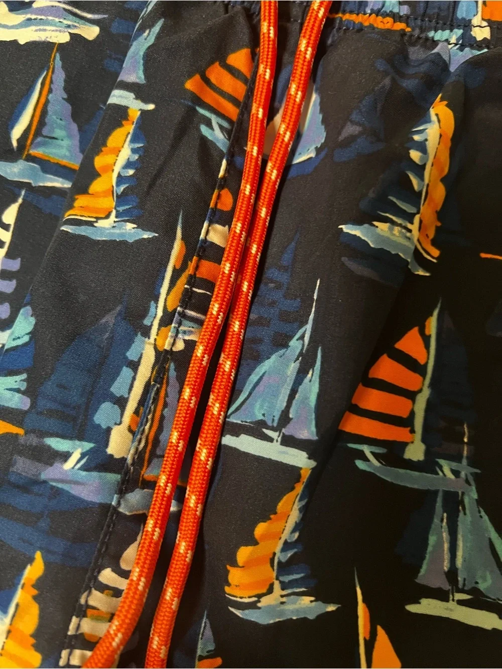 TOMMY BAHAMA RELAX NAVY TRUNKS W/ORANGE/LT BLUE SAILBOAT PRINT. MEDIUM